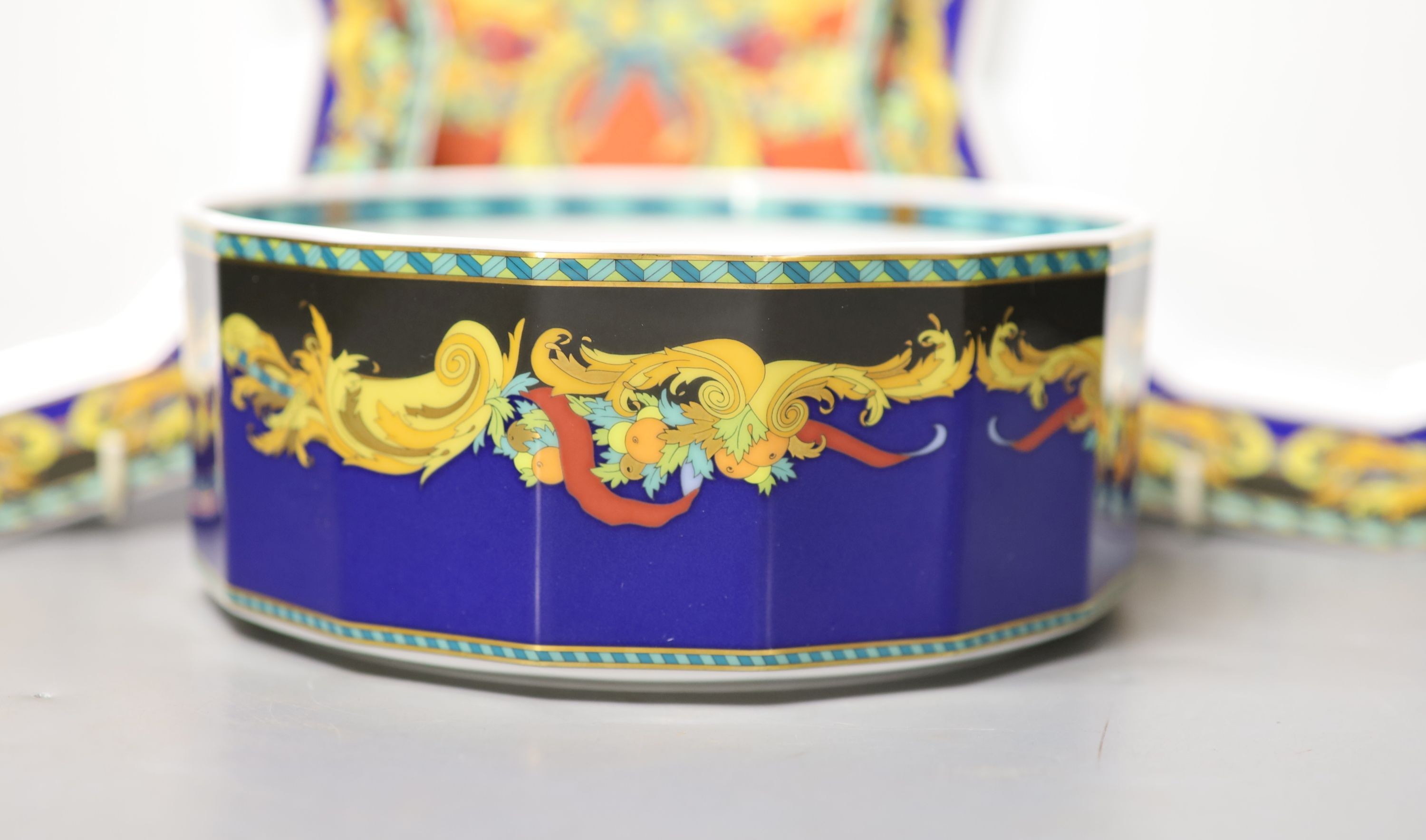 A group of Versace Rosenthal Le Roi Soleil plates and coffee cups and saucers and a bowl, 18.5cm, ten in total